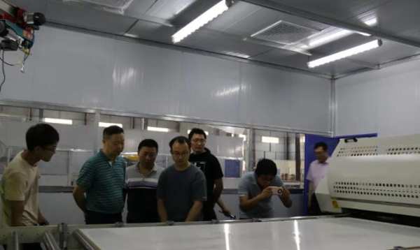 新威林板业、天湘板业公司董事前往中林装饰纸参观考察